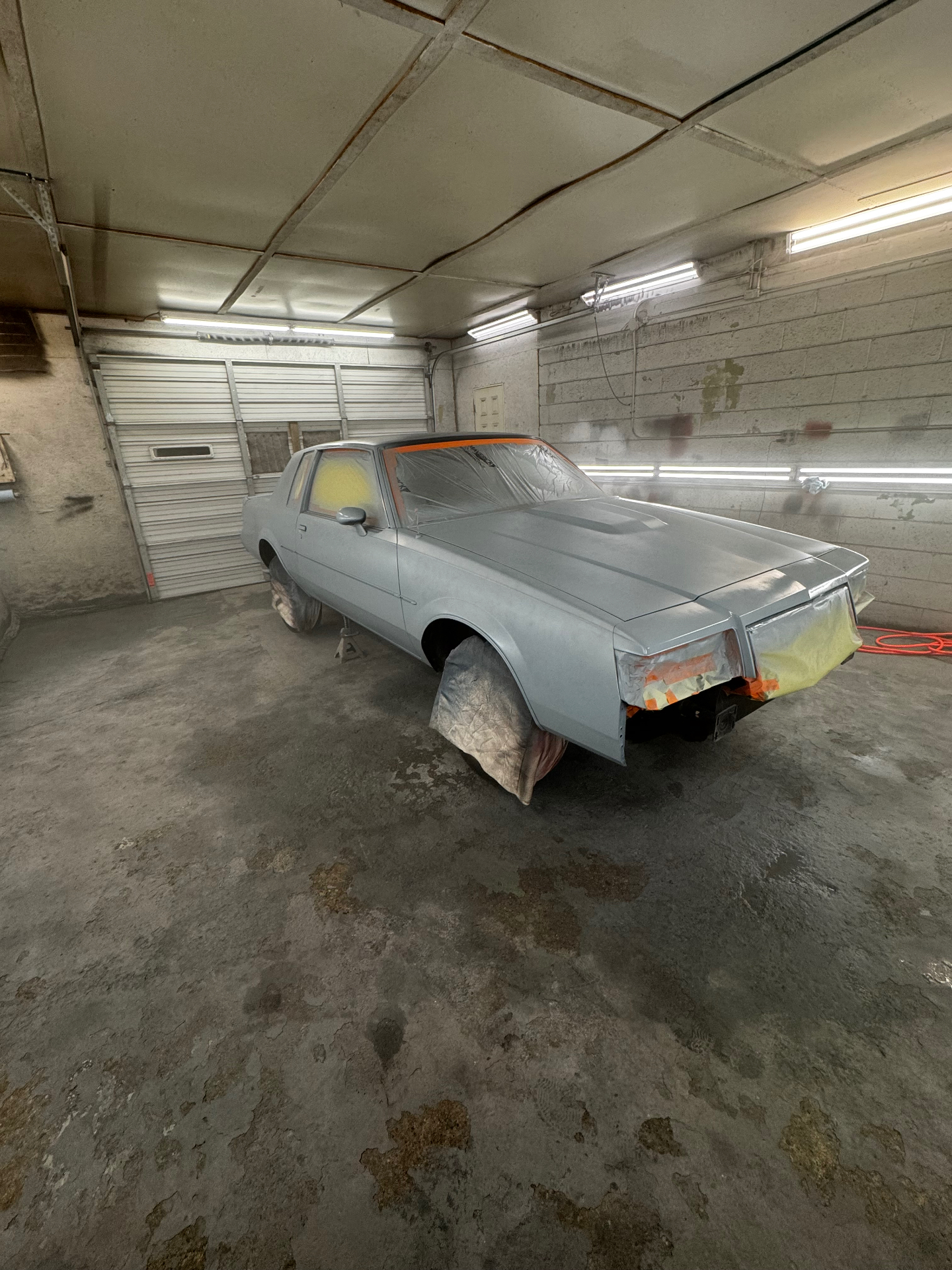 Buick coupe masked off and prepped, before body repair