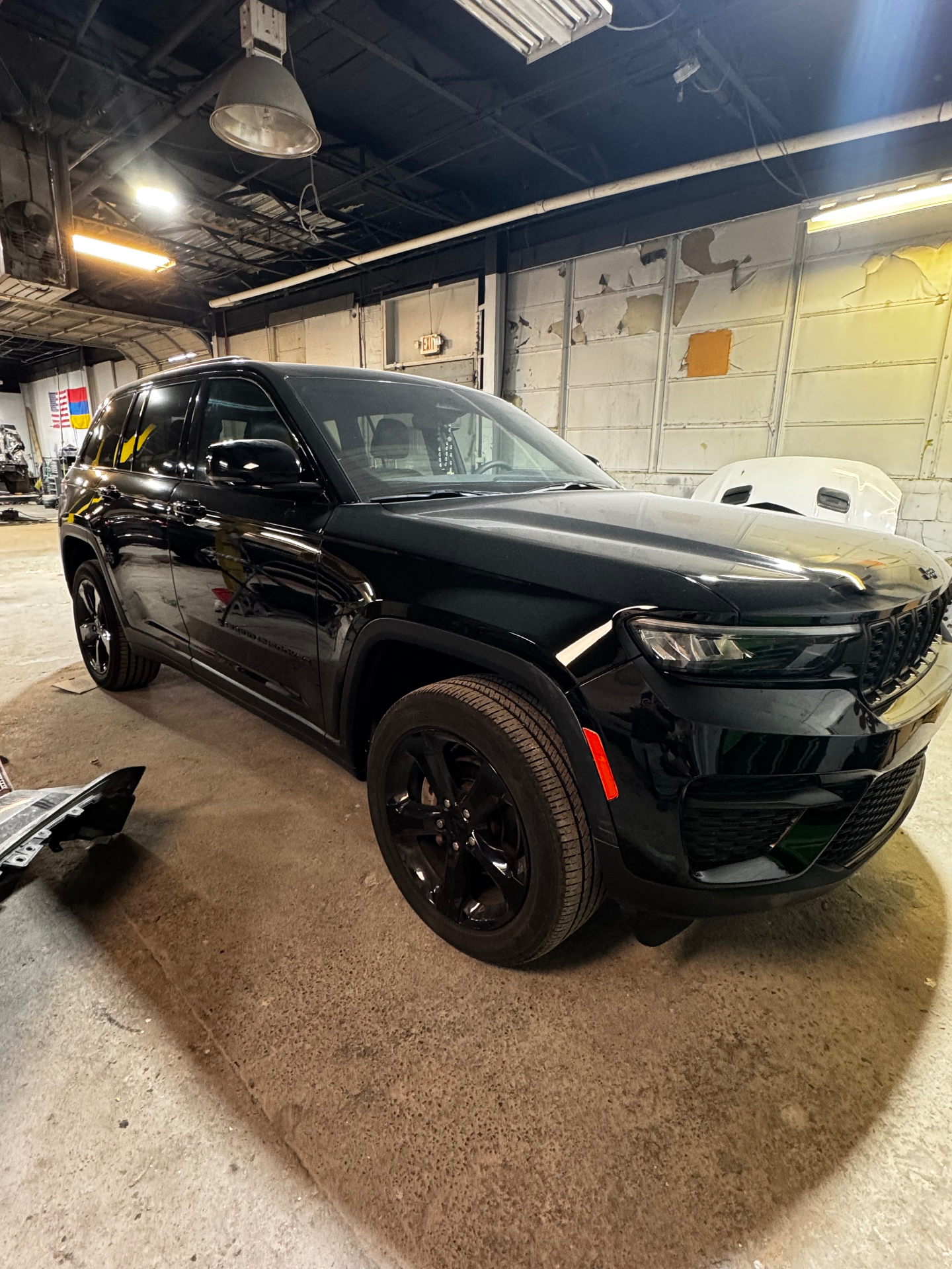 Black Jeep Grand Cherokee finished after body repair at the shop