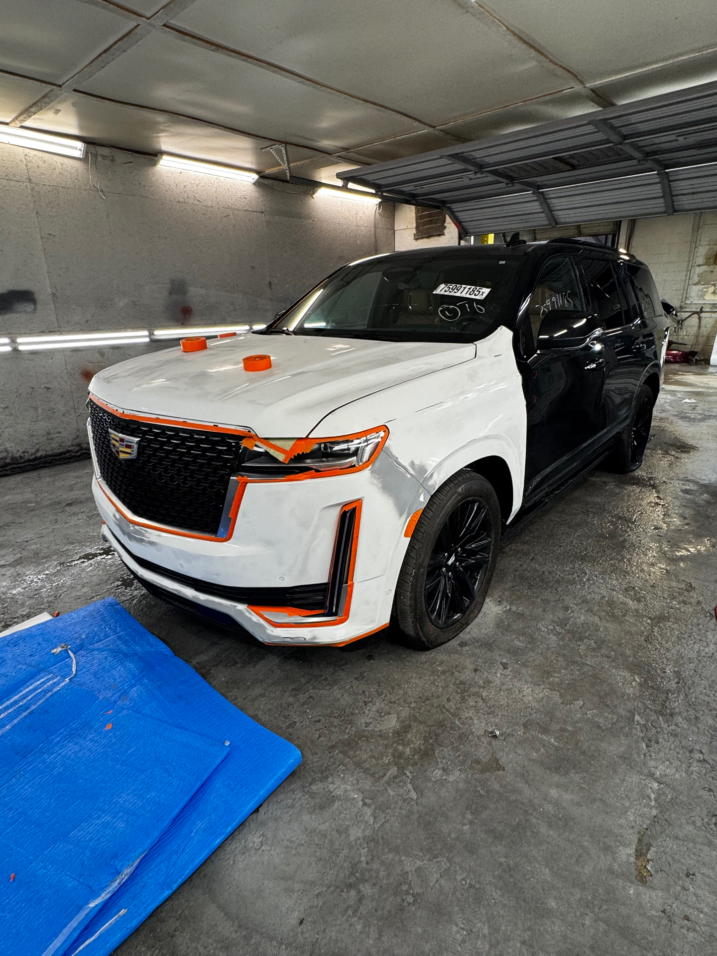 Cadillac Escalade masked off and prepped, before body repair